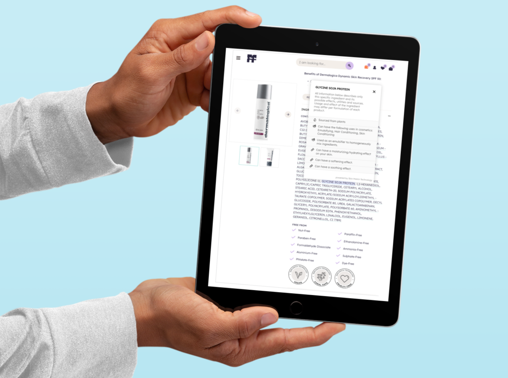 A person holding a tablet displaying product ingredient details and benefits on an e-commerce website, emphasizing transparency in skincare formulations.